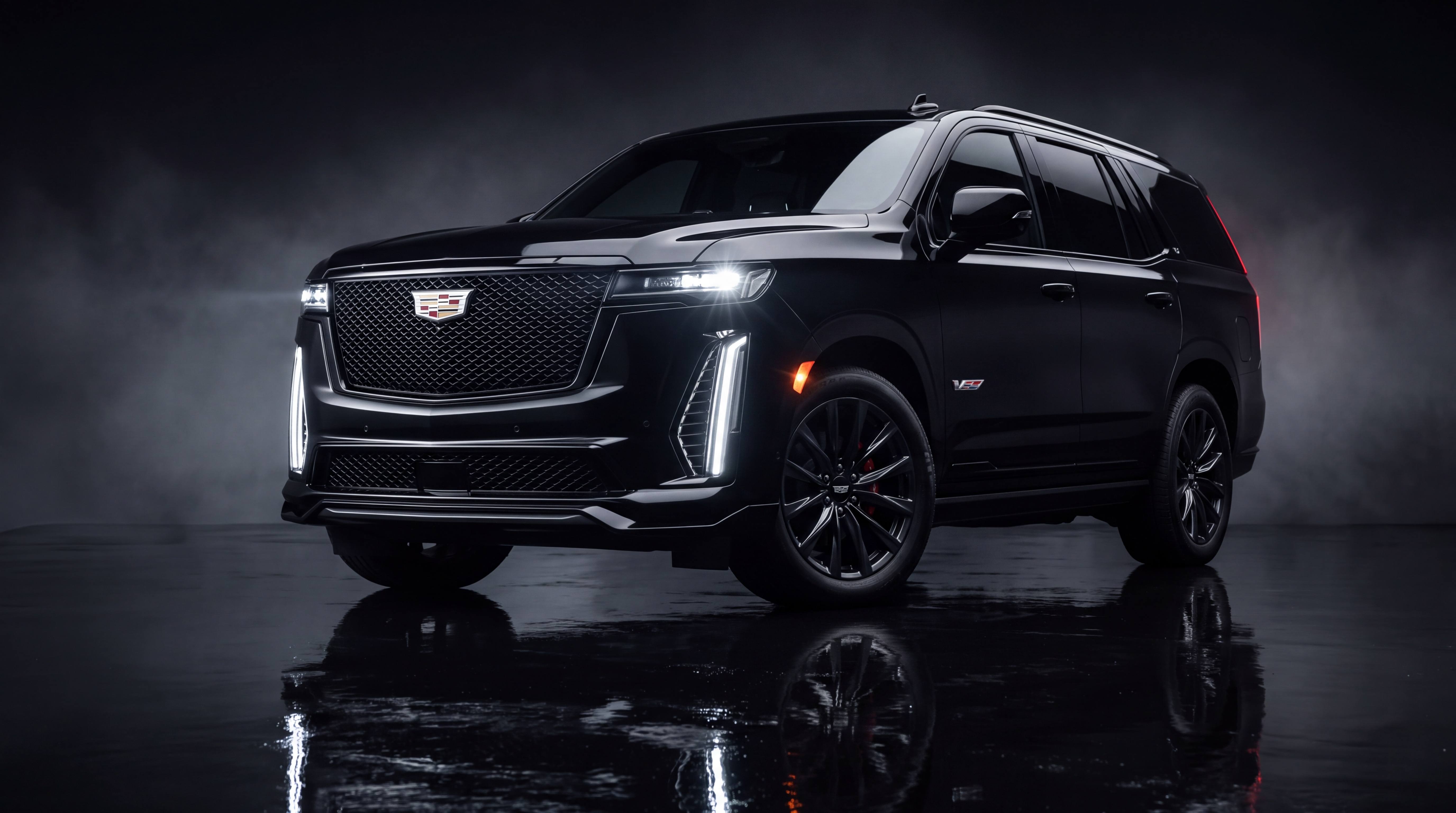 Black Cadillac Escalade-V in a dark studio